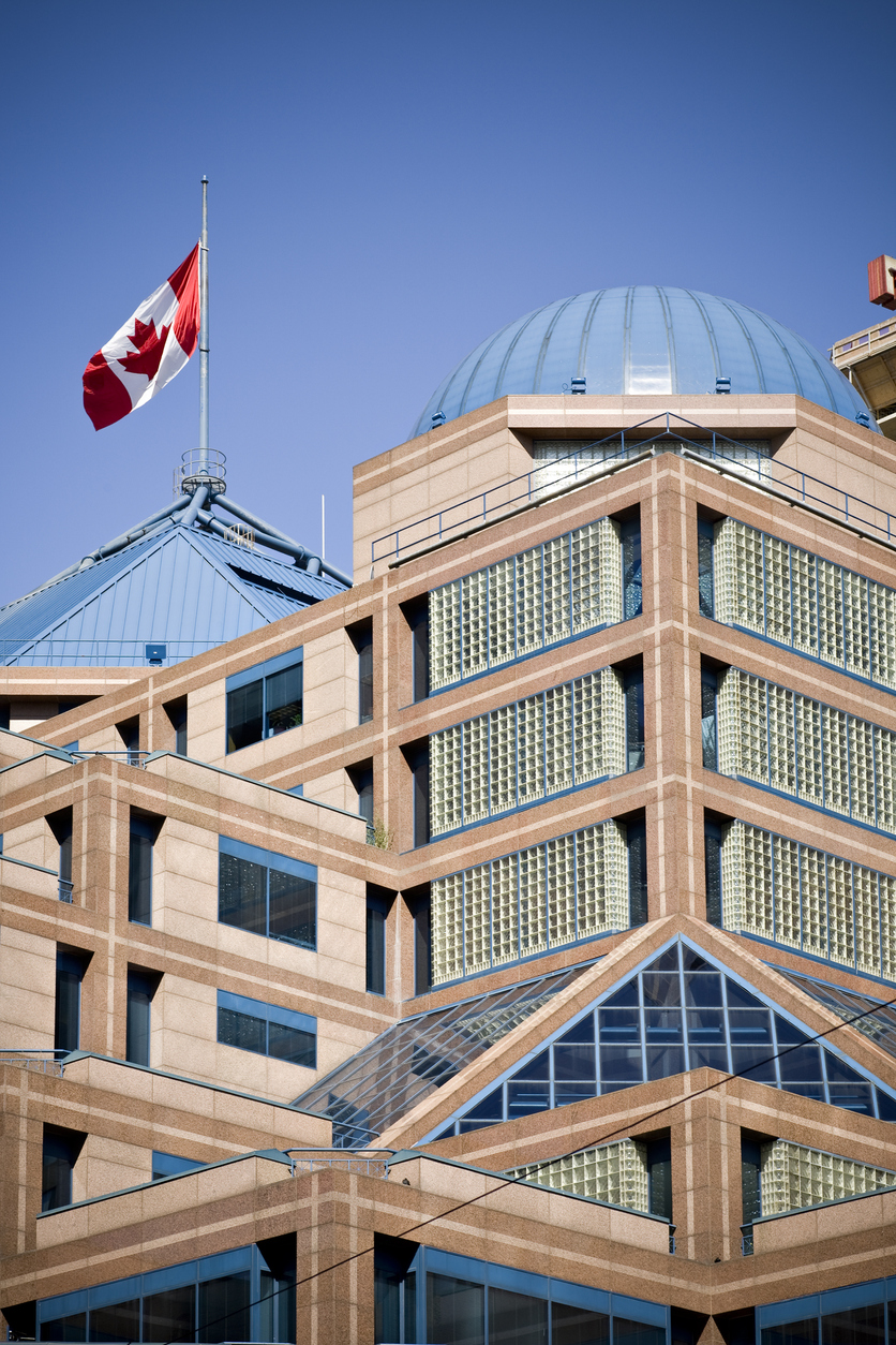 An image of Toronto Police Headquarters where you would historically have to go to obtain a criminal record check in Toronto before Triton made them available online.