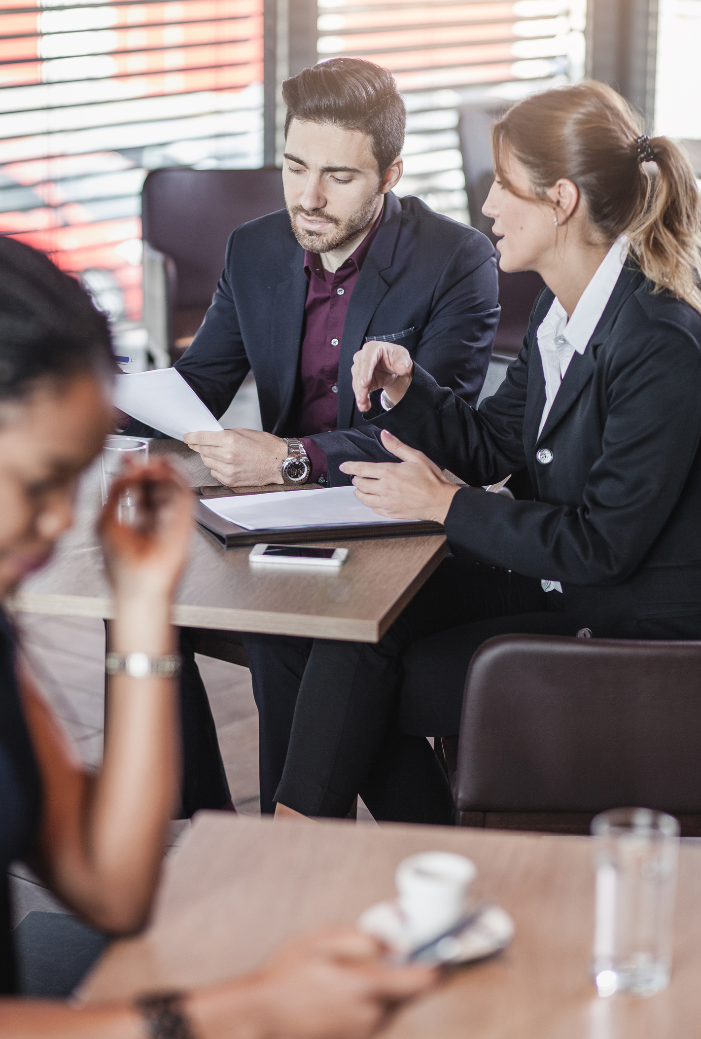 Private security professionals collaborating about a criminal record check.