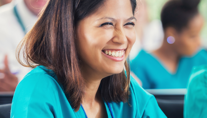 Nurse smiling due to the nursing job opportunities in Canada