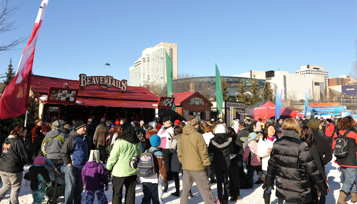 busy winter festival with a beavertails shop that employees required a criminal record check