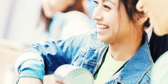 image of a young smiling teenager at a high school volunteering opportunity