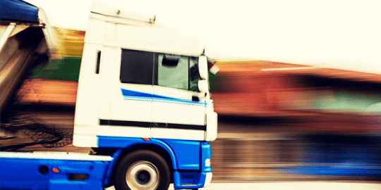 image of a big mac truck driving on highway